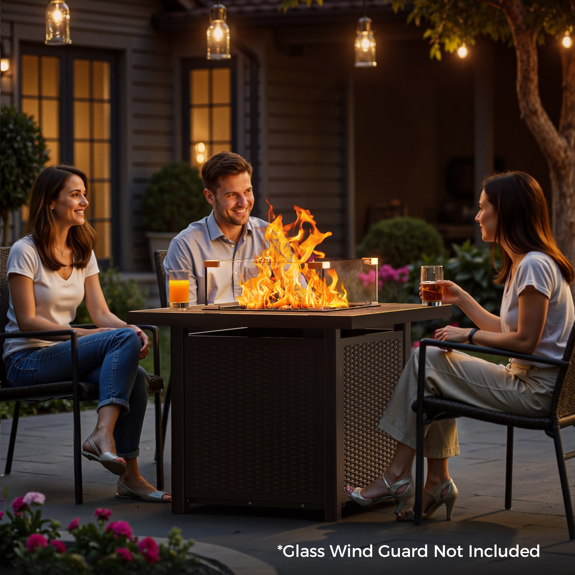 32 inch square brown propane fire pit table with tiled top, woven base, and bright flames, enjoyed by people outdoors.
