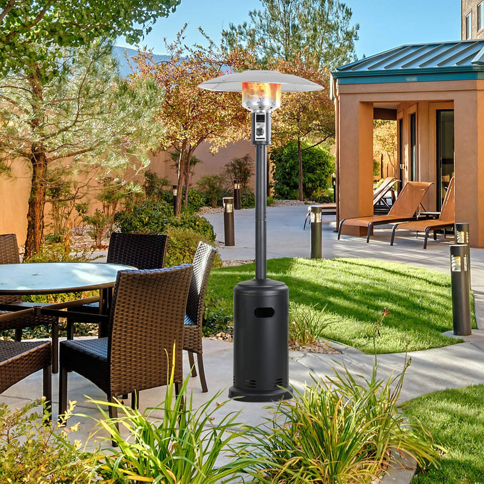 Black 32 inch propane patio heater with silver umbrella reflector and visible flames on a paved patio with outdoor seating.
