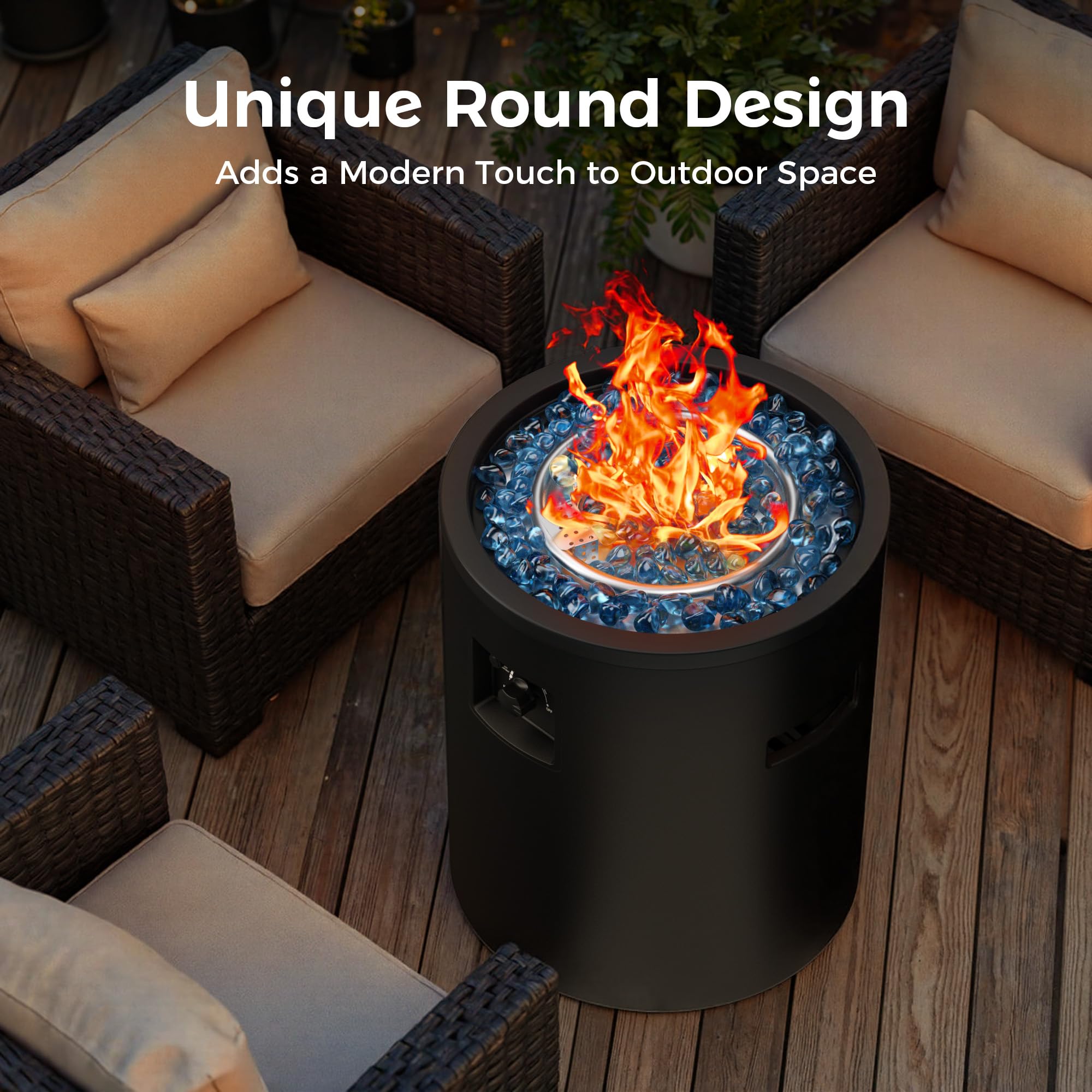 Black round propane fire pit with blue fire glass and dancing flames on a deck surrounded by wicker furniture.