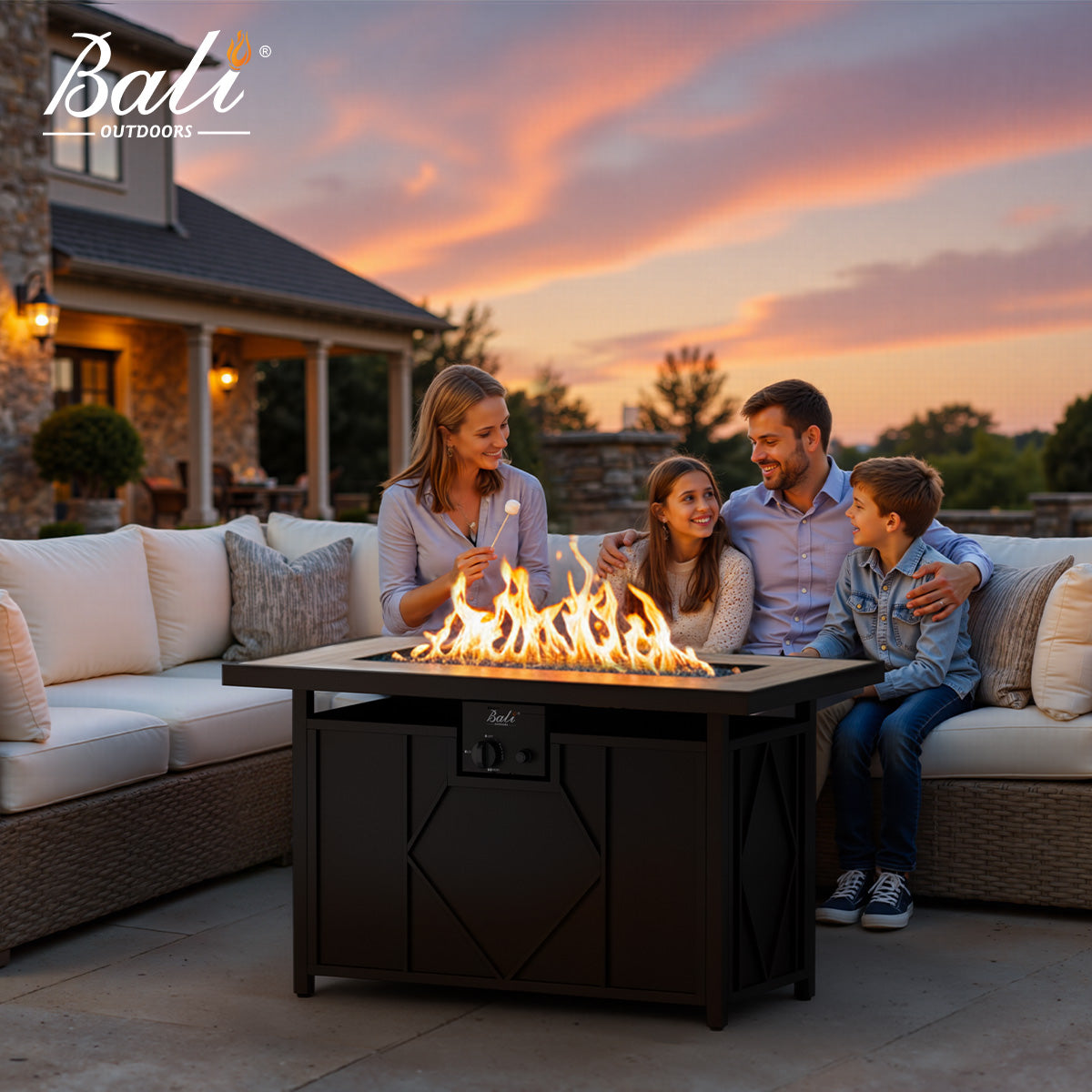 A family enjoying a square gas fire pit table on a patio.