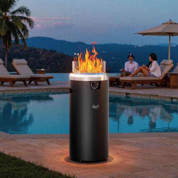 A modern, freestanding fire pit adds warmth and style to a poolside patio, creating a luxurious and relaxing ambiance.